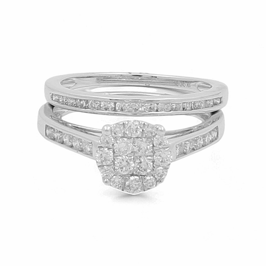 The 10K White Gold Bridal Woman Ring by Miral Jewelry showcases a central round cluster of diamonds complemented by smaller diamonds intricately embedded in the split shank band.