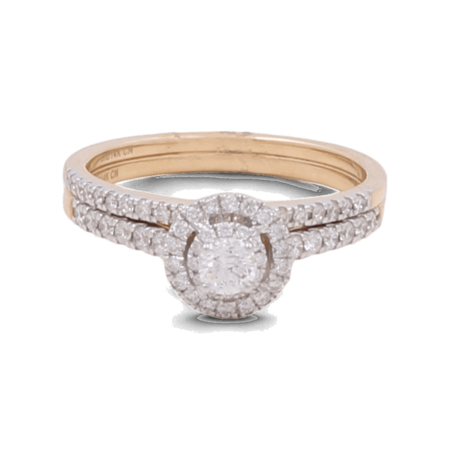 The Miral Jewelry 14K Yellow Gold Bridal Woman Ring with Diamonds is a breathtaking piece, showcasing a round diamond center stone enveloped by a halo of smaller diamonds, with additional sparkling diamonds set along the band.