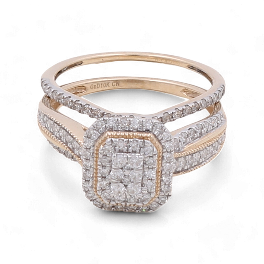 The 10K Yellow Gold Bridal Woman Ring with Diamonds by Miral Jewelry features an intricately adorned square diamond cluster setting and a split band design, making it the perfect choice for a 10K yellow gold bridal ring.