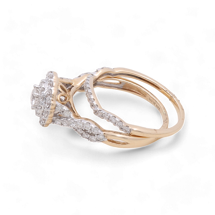 Behold the exquisite 14K Yellow Gold Bridal Woman Ring by Miral Jewelry, showcasing an intricate design adorned with sparkling diamonds encircling a captivating central diamond cluster.