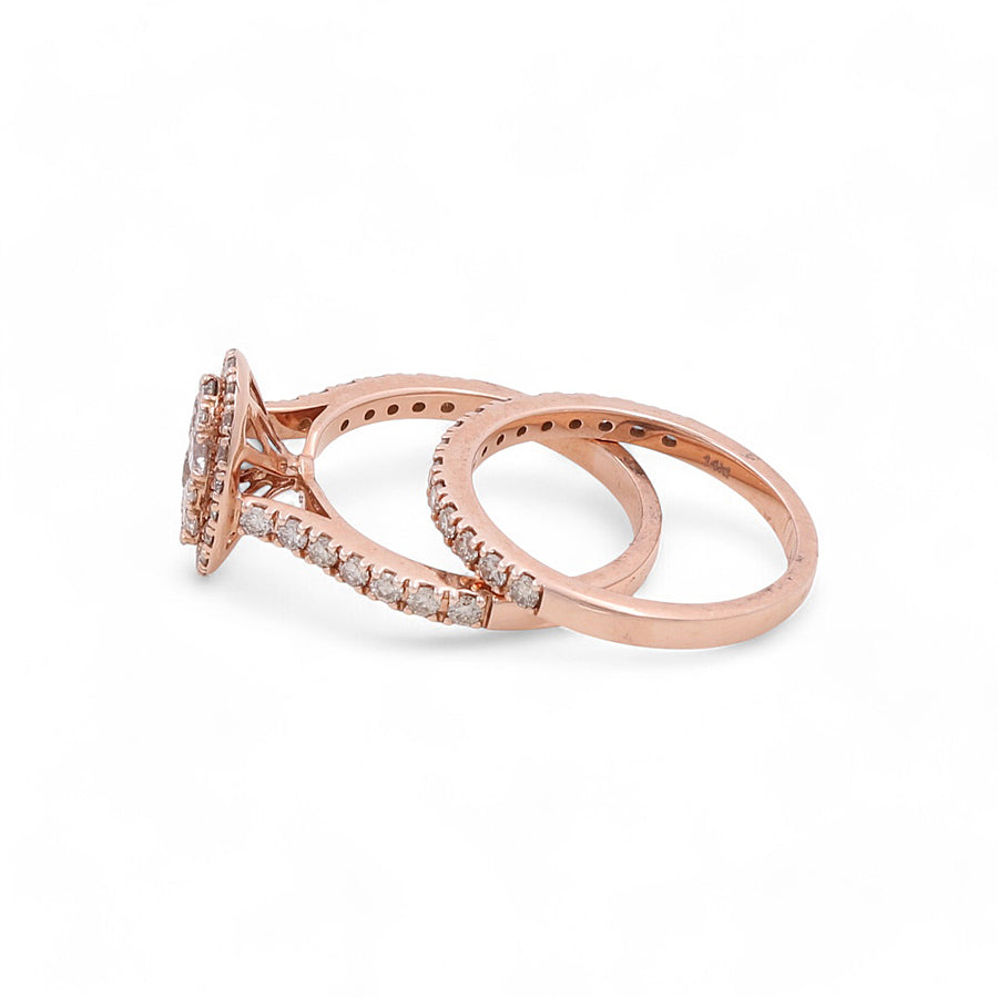 A 14K rose gold bridal ring from Miral Jewelry, featuring one with a solitaire diamond setting and another adorned with a band of smaller diamonds.