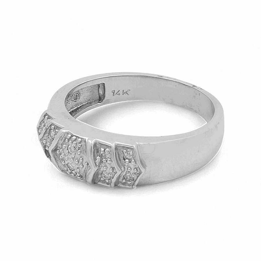 The Miral Jewelry 14K White Gold Bridal Men's Ring features intricate geometric patterns adorned with small diamond accents and is marked with "14K" on the inner band.