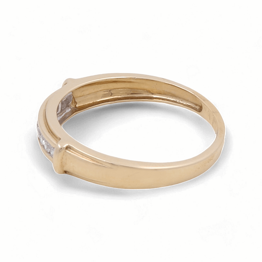 Introducing the 14K Yellow Gold Bridal Men Ring with Diamonds from Miral Jewelry, a minimalist wedding band featuring a single diamond, perfect for grooms.