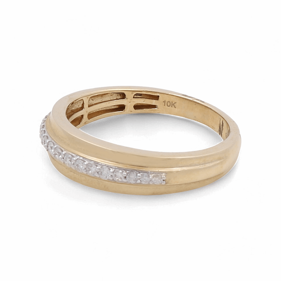 The 10K Yellow Gold Bridal Men's Ring with Diamonds by Miral Jewelry features a row of small, dazzling diamonds embedded along its top. The interior is meticulously engraved with "10K," adding a refined touch to this elegant piece suitable for any occasion.