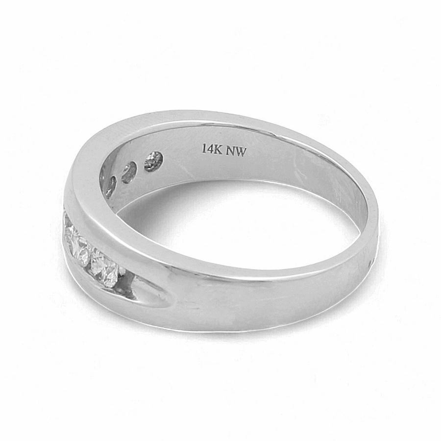 The Miral Jewelry 14K White Gold Bridal Men Ring with Diamonds is a luxurious men's ring featuring "14K NW" engraved inside the band and three small diamonds embedded in a diagonal row.