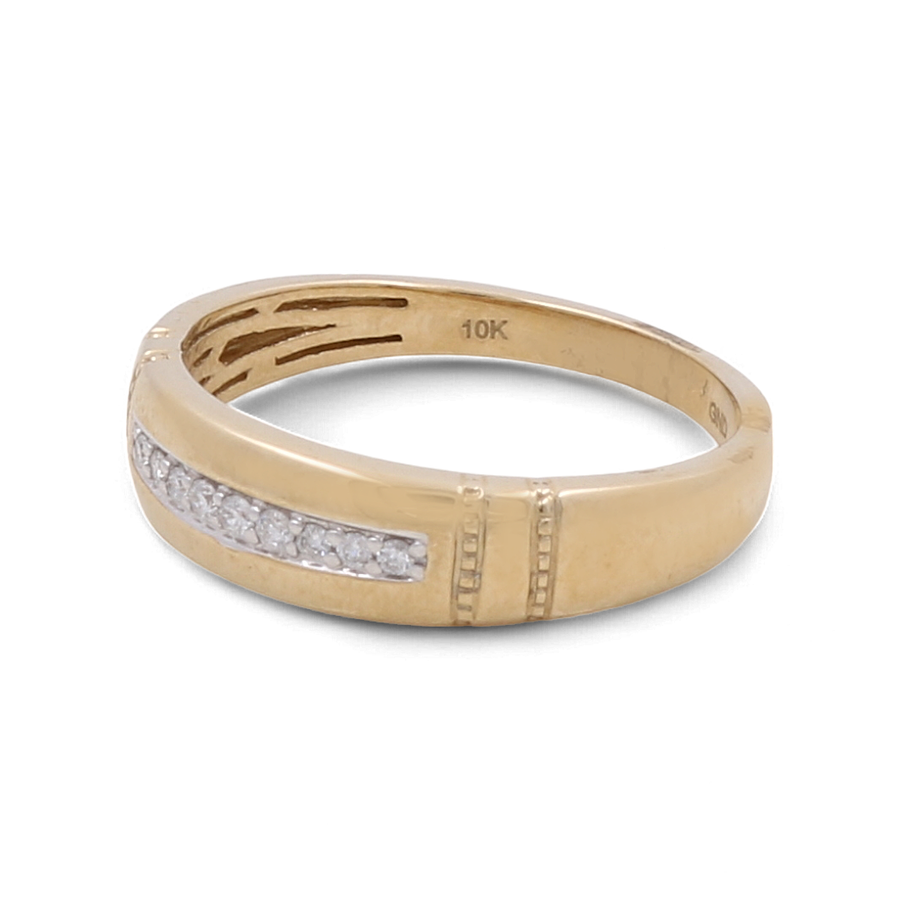 The 10K Yellow Gold Bridal Men Ring with Diamonds by Miral Jewelry features a row of small diamonds set in the center band. Crafted from 10K yellow gold, this stunning men's bridal ring has an engraving inside that reads "10K.