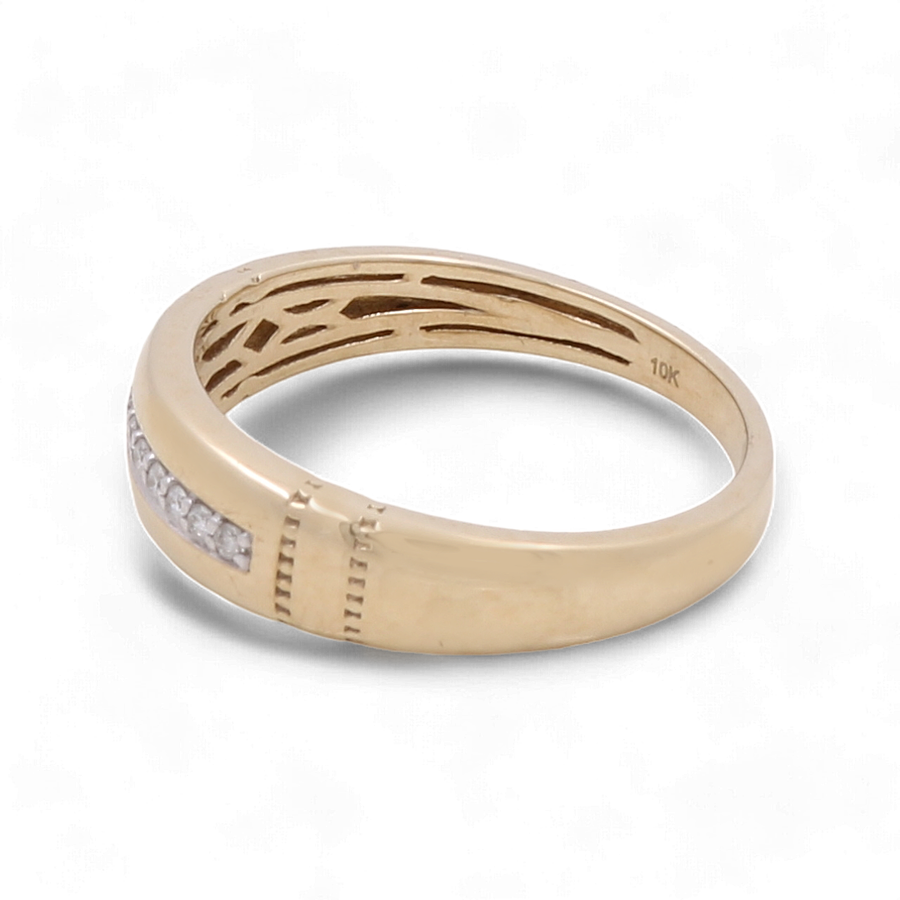 The Miral Jewelry 10K Yellow Gold Bridal Men Ring with Diamonds showcases an intricate cut-out design and a row of small diamonds, set against a plain white background.