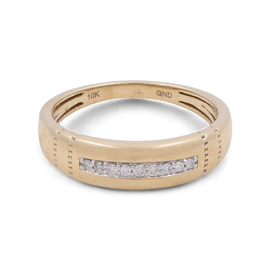 The 10K Yellow Gold Bridal Men Ring with Diamonds by Miral Jewelry features a horizontal row of small clear gemstones across the front. The inside band is engraved with "10K" and "GND". Perfect as a men's bridal ring, its understated elegance is timeless.