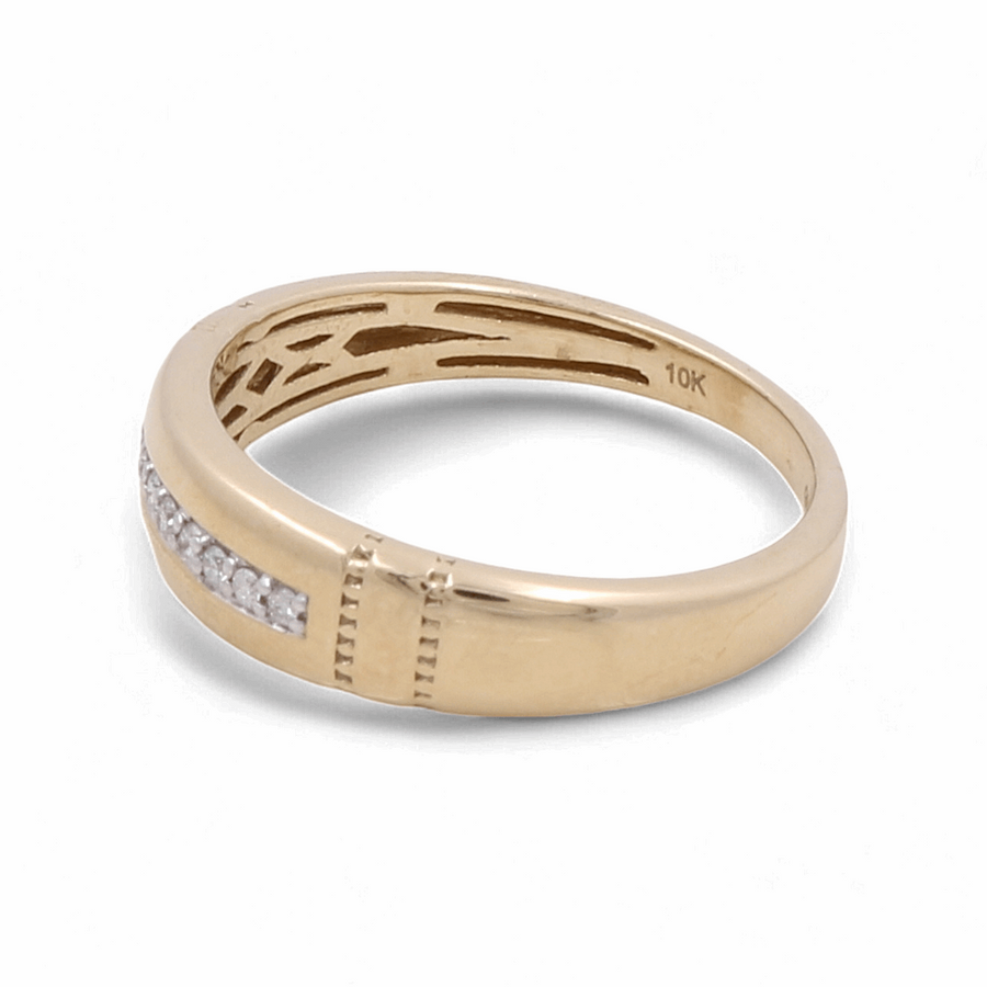 Discover the exquisite 10K Yellow Gold Bridal Men's Ring by Miral Jewelry, showcasing a line of glistening diamonds on one side and an elegantly inscribed "10K" on the interior.