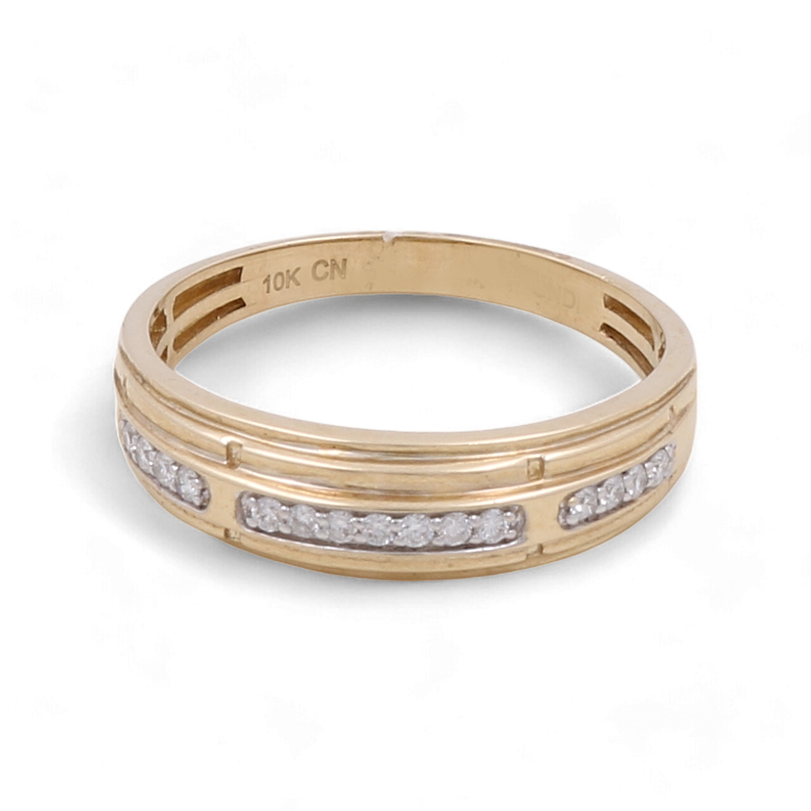 The Miral Jewelry 10K Yellow Gold Bridal Men Ring with Diamonds, featuring an engraved "10K CN" stamp and a row of small white stones set in the band, is an exquisite piece that complements any bridal set beautifully.