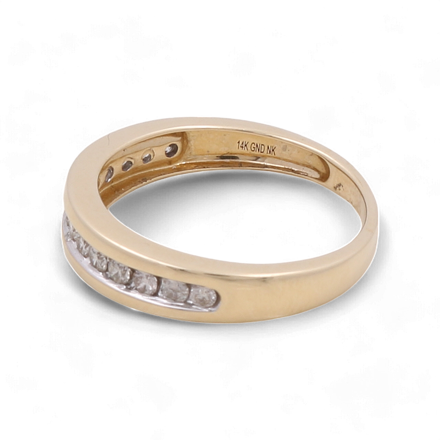 A 10K yellow gold men's ring from Miral Jewelry, known as the 10K Yellow Gold Bridal Men Ring with Diamonds, featuring a row of embedded diamonds and an inscription inside reading "14K GND NK.