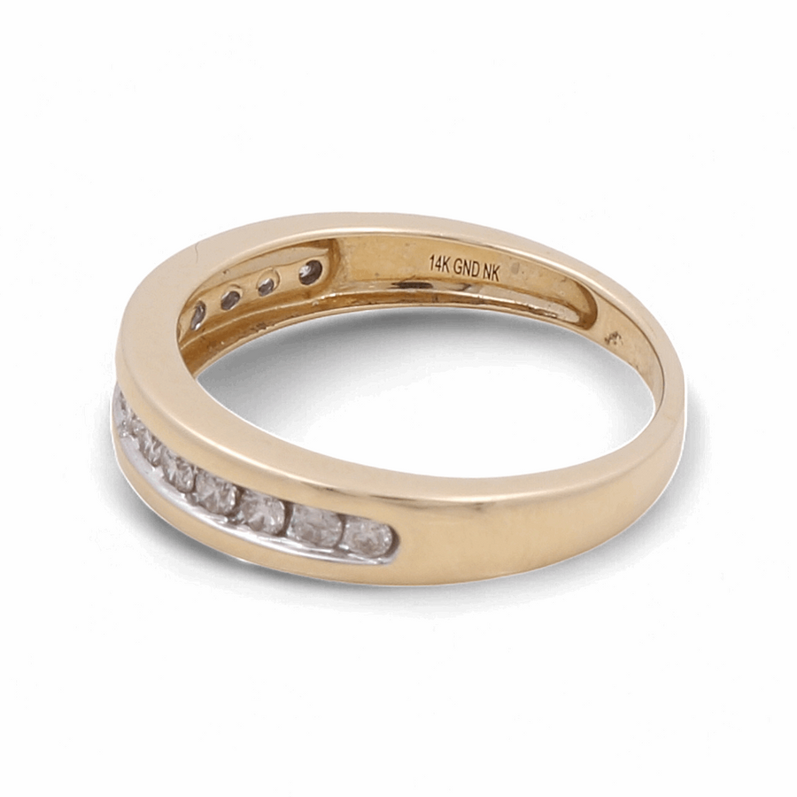 A 10K yellow gold men's ring from Miral Jewelry, known as the 10K Yellow Gold Bridal Men Ring with Diamonds, featuring a row of embedded diamonds and an inscription inside reading "14K GND NK.