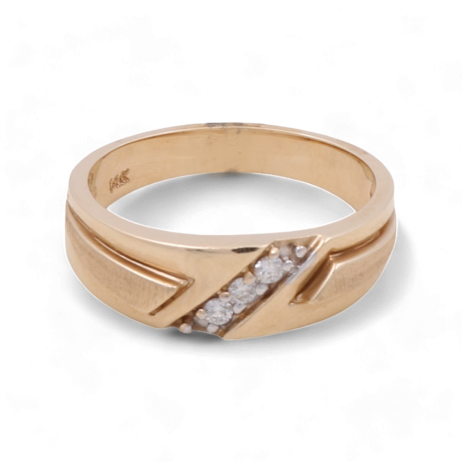 Miral Jewelry's 14K Yellow Gold Bridal Men's Ring with Diamonds features a gold band adorned with a row of small white diamonds set diagonally across the top. This elegant ring is crafted in 14K yellow gold, showcasing a smooth finish and subtle ridges on the sides.