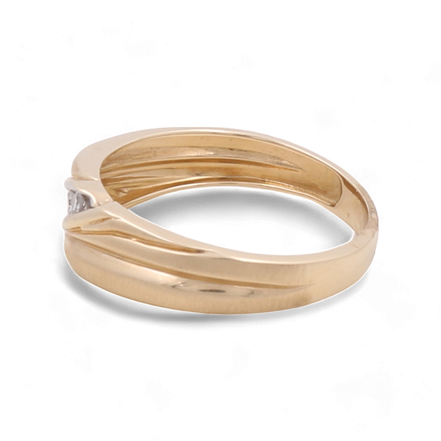 The Miral Jewelry 14K Yellow Gold Bridal Men's Ring features a simple band design with a small, central set diamond, beautifully crafted for an elegant angle view.