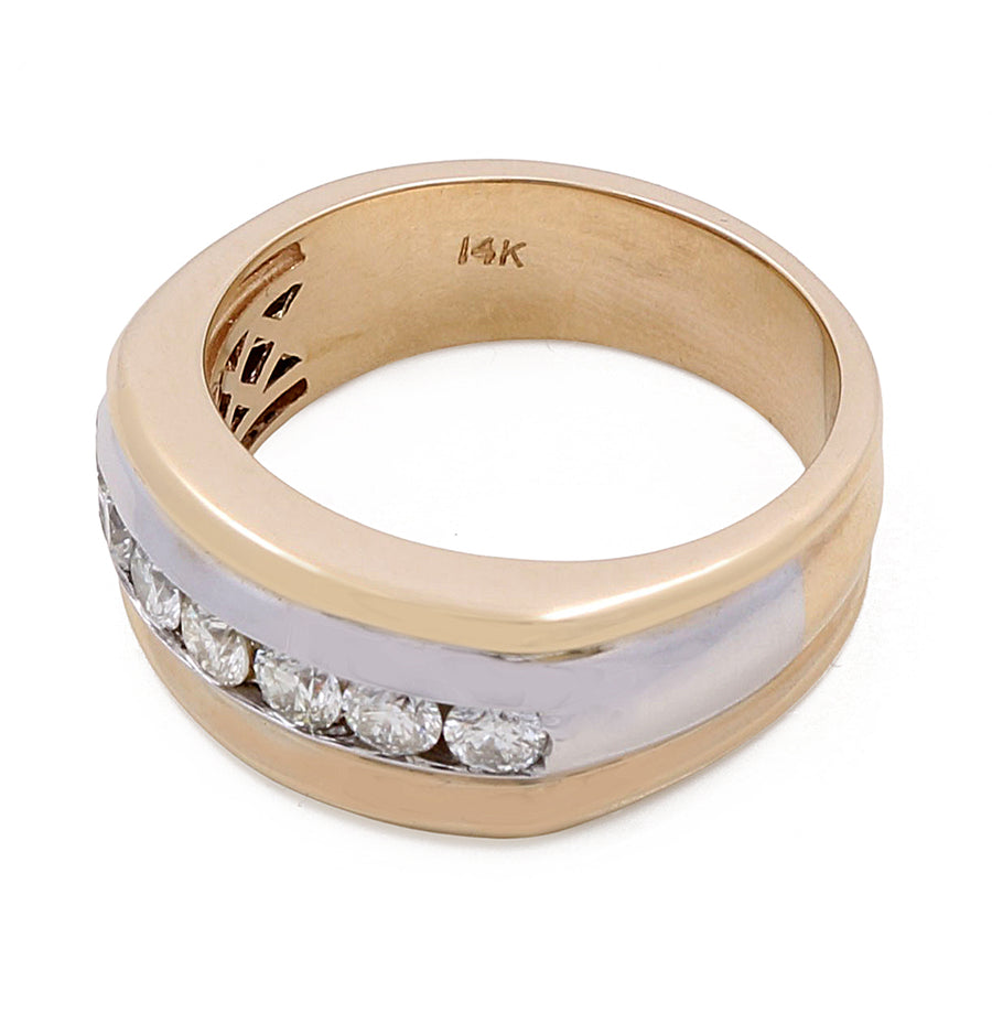 A gold ring with the inscription "14K" on the inner band. This **Miral Jewelry 14k Yellow and White Gold Fashion Ring with 0.92Tw Round Diamonds** features a white gold or platinum stripe embedded with seven small, evenly spaced round diamonds, making it a stunning addition to any jewelry collection.