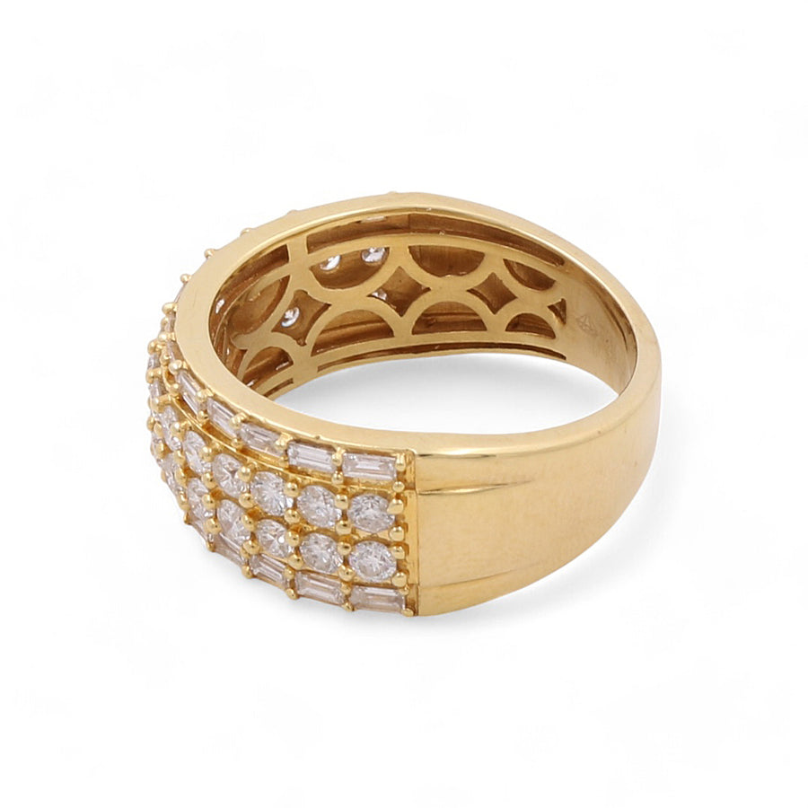 Introducing the Miral Jewelry 14K Yellow Gold Fashion Diamond Women's Ring, crafted with a wide band adorned with multiple rows of small round and rectangular diamonds. This fashion-forward design is complemented by an intricately patterned interior, making it a stunning addition to any jewelry collection.