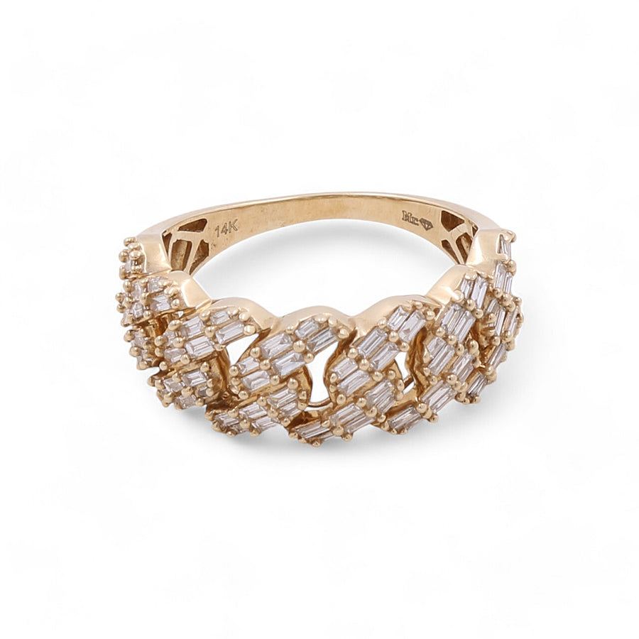 A 14K Yellow Gold ring with intricate patterns and numerous small rectangular and round-cut diamonds set along its band, displayed on a plain white background. This stunning 14K Yellow Gold Fashion Diamond Women's Ring by Miral Jewelry is the perfect addition to any collection.