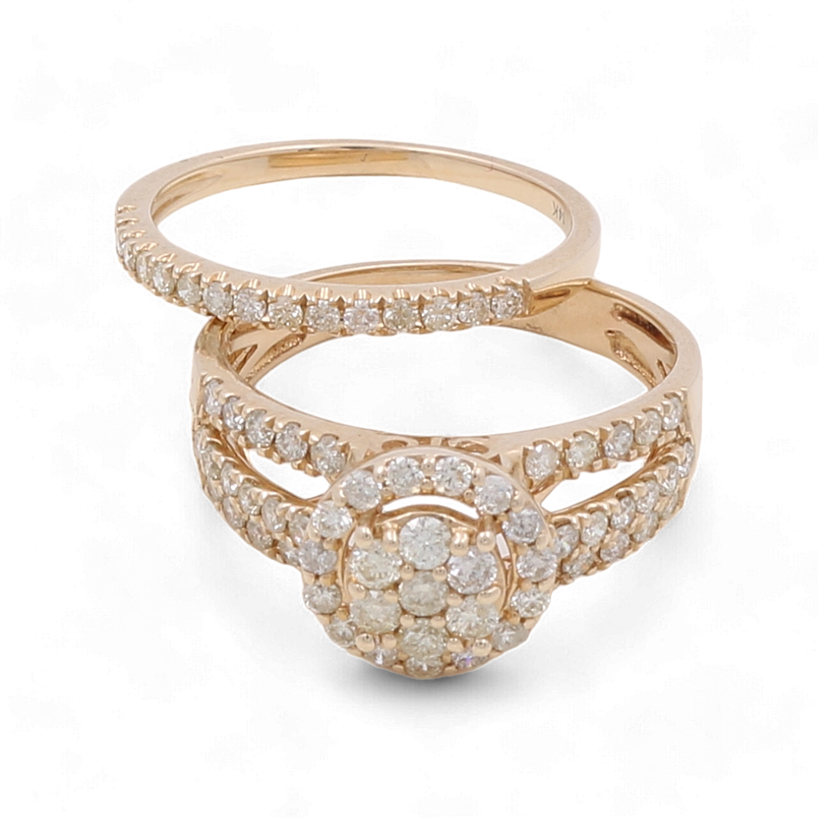 The Miral Jewelry 14K Yellow Gold Bridal Woman Ring with Diamonds set includes two exquisite pieces: a delicate band embellished with small diamonds, and a wider split shank ring featuring a central circular cluster of diamonds.