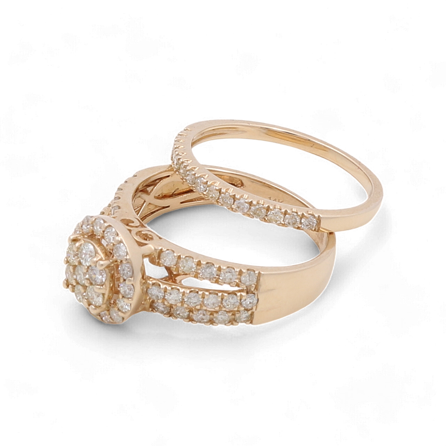 Presenting the Miral Jewelry set: two exquisite bridal woman rings. The first is a 14K Yellow Gold Bridal Woman Ring with Diamonds, featuring a round halo setting encrusted with brilliant diamonds. The second ring is a sleek and elegantly simple band also adorned with small diamonds.