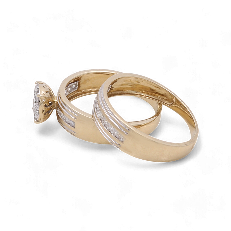 Two gold rings from Miral Jewelry, including one with a prominent diamond setting, placed next to each other on a white background, epitomize the elegance of fine jewelry. These stunning pieces perfectly complement the charm of any 10K Yellow Gold Bridal Woman Ring with Diamonds.