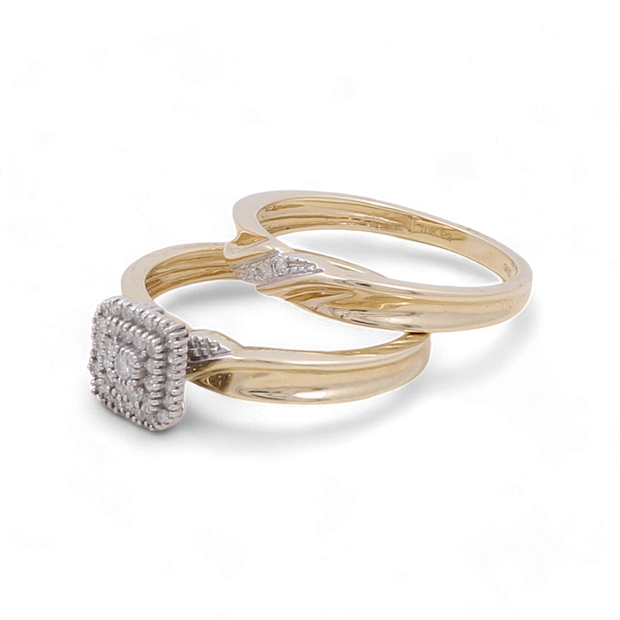 A pair of bridal rings from Miral Jewelry, featuring the 10K Yellow Gold Bridal Woman Ring with Diamonds, one adorned with a diamond-studded square-shaped setting and both showcasing simple band designs.