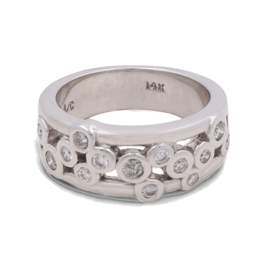 Presenting the Miral Jewelry 14K White Gold Woman Diamond Fashion Ring: This exquisite ring features multiple small round diamonds embedded in a scattered pattern across the silver-toned band. The inside of the band is marked "14K," signifying its high-quality craftsmanship. Perfect for a wedding ensemble, this ring exudes timeless elegance and sophisticated charm.