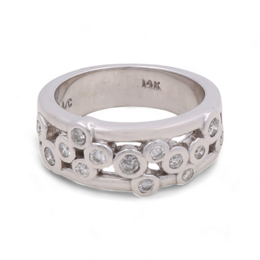 Presenting the Miral Jewelry 14K White Gold Woman Diamond Fashion Ring: This exquisite ring features multiple small round diamonds embedded in a scattered pattern across the silver-toned band. The inside of the band is marked "14K," signifying its high-quality craftsmanship. Perfect for a wedding ensemble, this ring exudes timeless elegance and sophisticated charm.