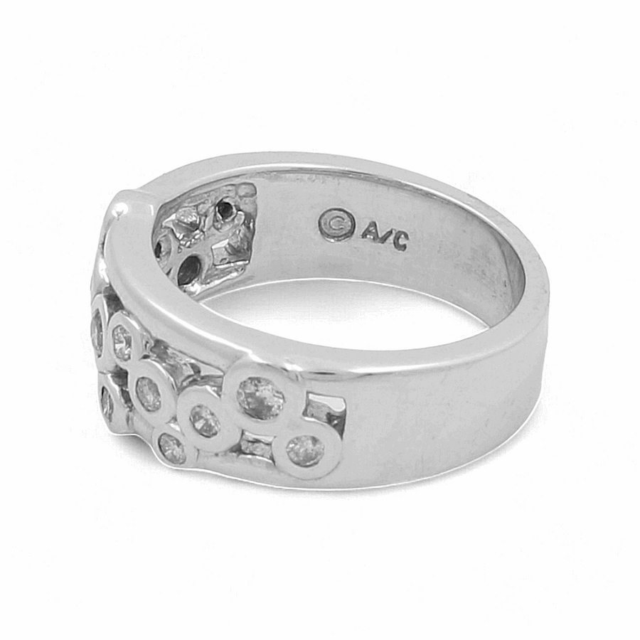 A 14K white gold fashion ring by Miral Jewelry, showcasing multiple embedded circular gemstones and an engraved "C AVC" mark on the inner band, perfect for complementing a sophisticated wedding ensemble.