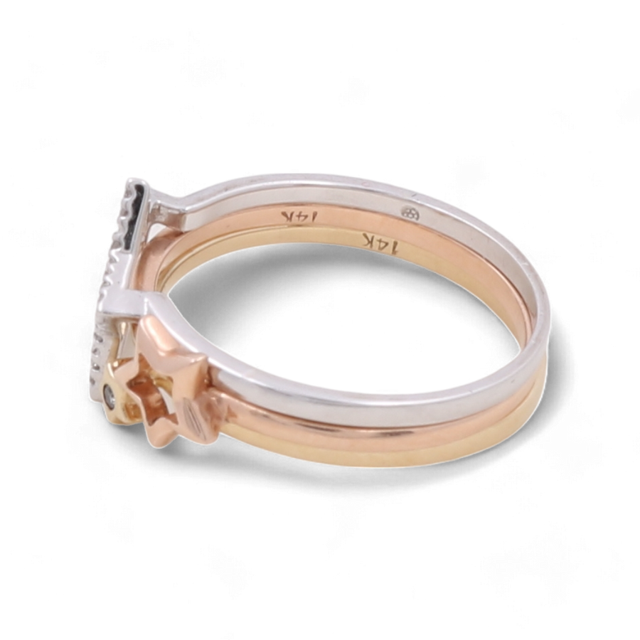 The 14K White Gold Woman Diamond Fashion Ring with Star by Miral Jewelry is a luxurious piece, featuring star shapes on the sides and a square-shaped setting. The inside of the band showcases additional markings.