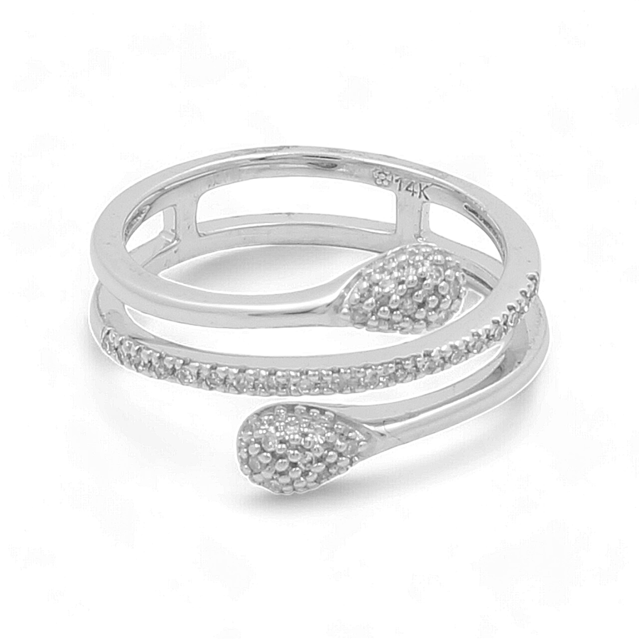 The 14K White Gold Woman Diamond Fashion Ring by Miral Jewelry, featuring a silver coiled snake design with textured detailing on the head and tail, exudes an air of elegance.