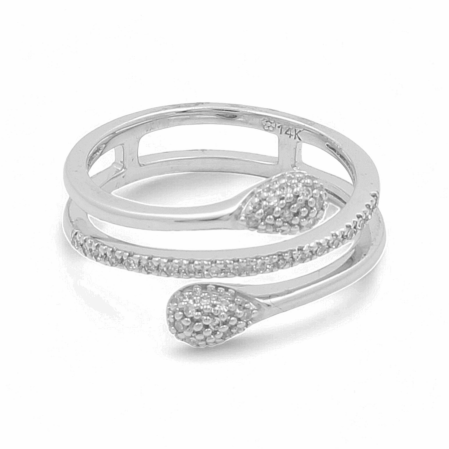 The 14K White Gold Woman Diamond Fashion Ring by Miral Jewelry, featuring a silver coiled snake design with textured detailing on the head and tail, exudes an air of elegance.