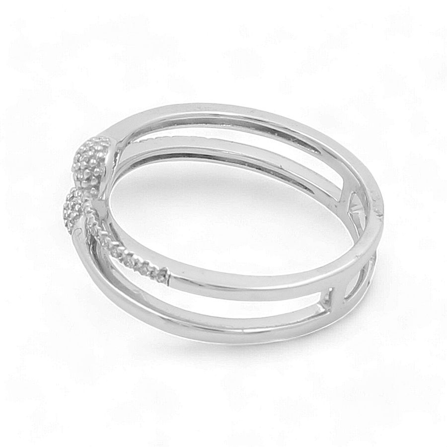 The 14K White Gold Woman Diamond Fashion Ring by Miral Jewelry features a double band design with textured detailing at the front, effortlessly combining elegance and style like a timeless diamond ring.