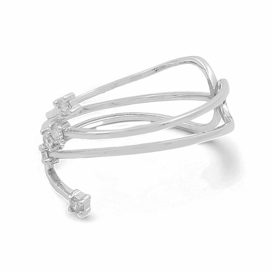 A silver, multi-band cuff bracelet with an open design, featuring intersecting bands of varying thickness. Pair it with the 14K White Gold Fashion Diamond Woman Ring by Miral Jewelry for a sparkling touch to any outfit.