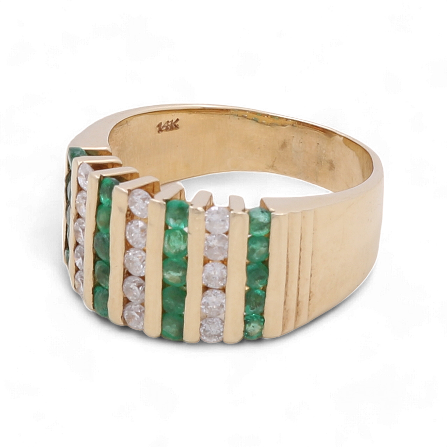 The Miral Jewelry 14K Yellow Gold Diamond Fashion Woman Ring features alternating vertical rows of green emeralds and white diamonds, totaling 1 ct diamond. The interior is stamped with "14K".