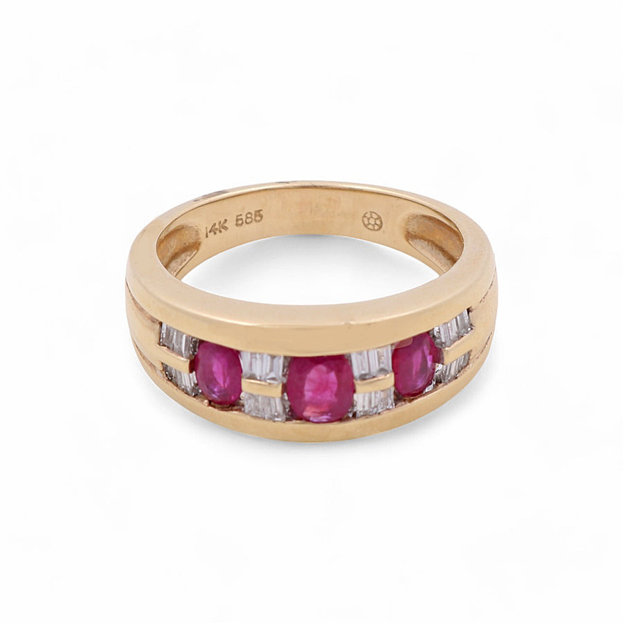 A 14K yellow gold ring by Miral Jewelry featuring three rubies and six small diamonds set in a rectangular pattern on a white background.