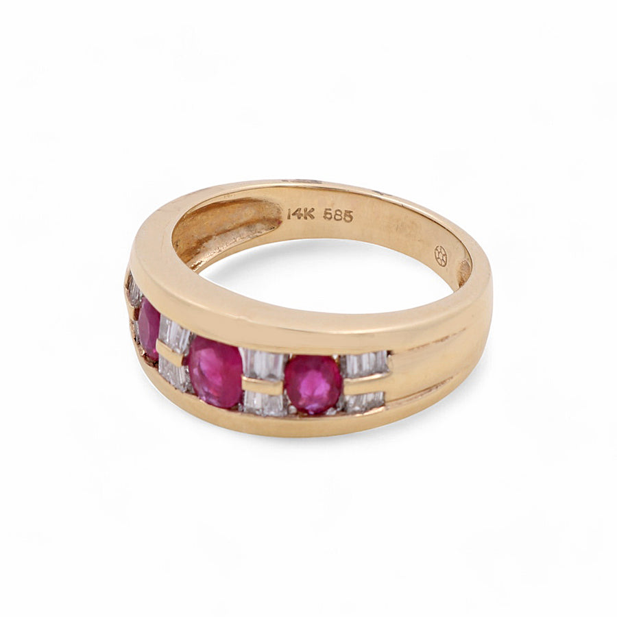 Introducing the Miral Jewelry 14K Yellow Gold Woman Fashion Ring, adorned with three oval rubies and several small rectangular clear stones. This exquisite piece is marked "14K 585" on the inside.