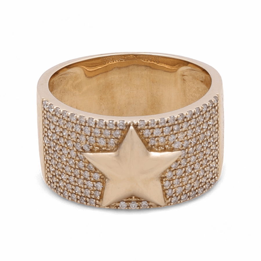 Introducing the 14K Yellow Gold Diamond Fashion Woman Ring with Star by Miral Jewelry, featuring a wide band encrusted with small diamonds and a central, raised star design.