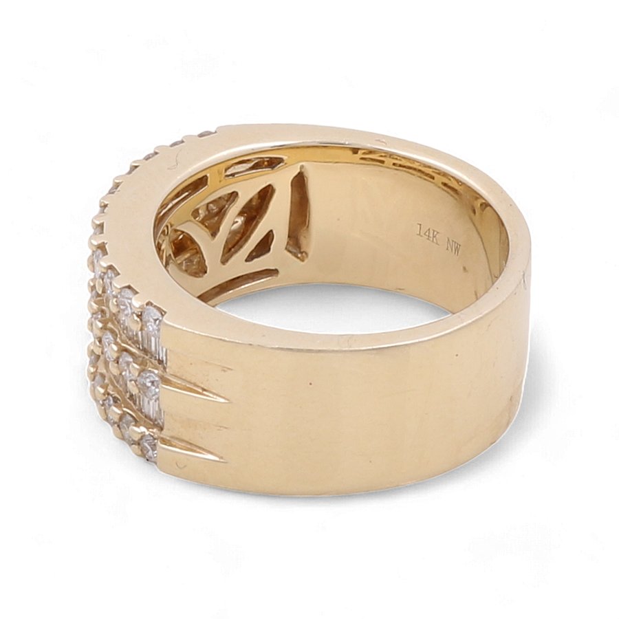 The 14K Yellow Gold Contemporary Diamond Fashion Ring by Miral Jewelry boasts a wide gold band adorned with a crisscross pattern and small square-cut diamonds arranged along one side. Engraved inside with "14K NW," this ring beautifully highlights the sophistication of 14k yellow gold.
