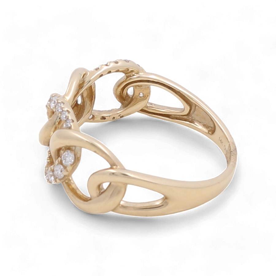 The 14K Yellow Gold Fashion Diamond Woman Ring by Miral Jewelry boasts an elegant intertwined design and features small fashion diamonds set in the front, making it the perfect accessory for any woman.