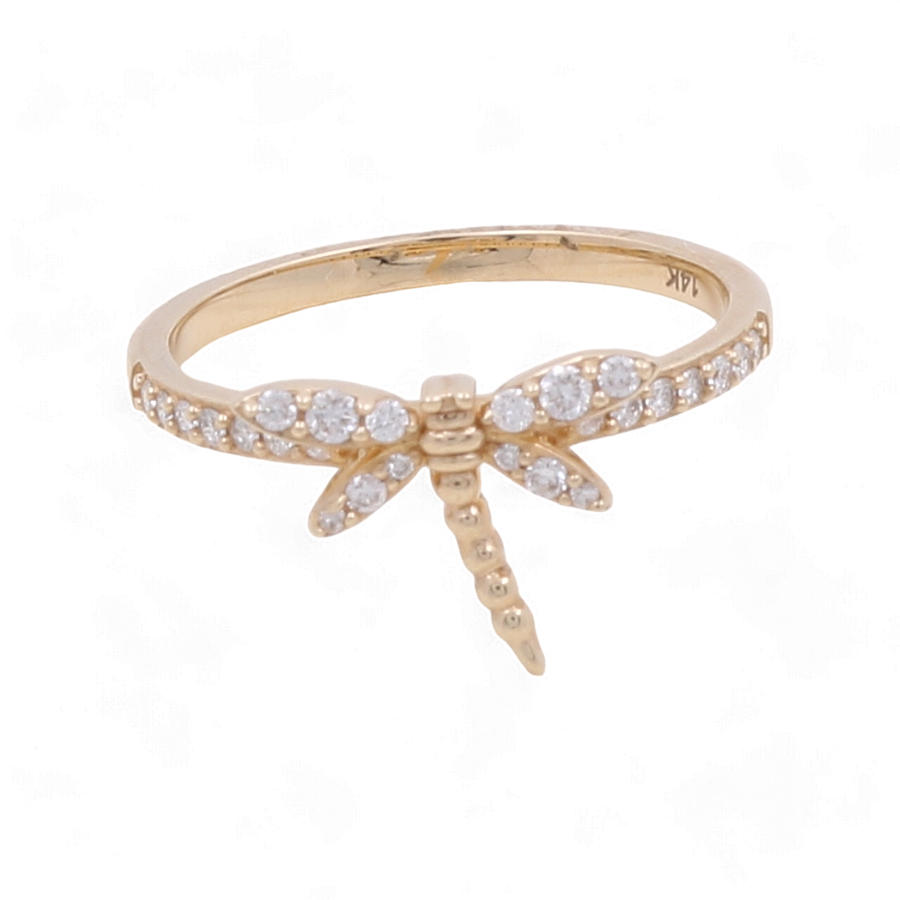 A 14K yellow gold woman ring by Miral Jewelry, featuring a dragonfly design adorned with fashion diamonds along the band and on the wings.