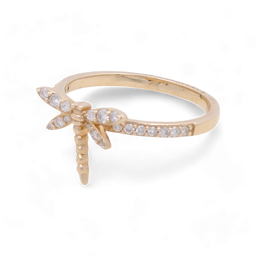 The 14K Yellow Gold Fashion Diamond Woman Ring by Miral Jewelry features a stunning dragonfly design with small embedded diamonds on the wings and body, making it an elegant addition that adds a touch of sophistication to any look.