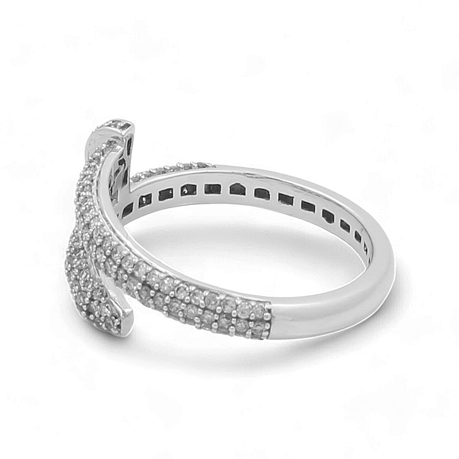 The Miral Jewelry 14K White Gold Fashion Diamond Woman Ring, showcases a split shank design accented with small round diamonds on both the band and the split section, radiating timeless elegance.