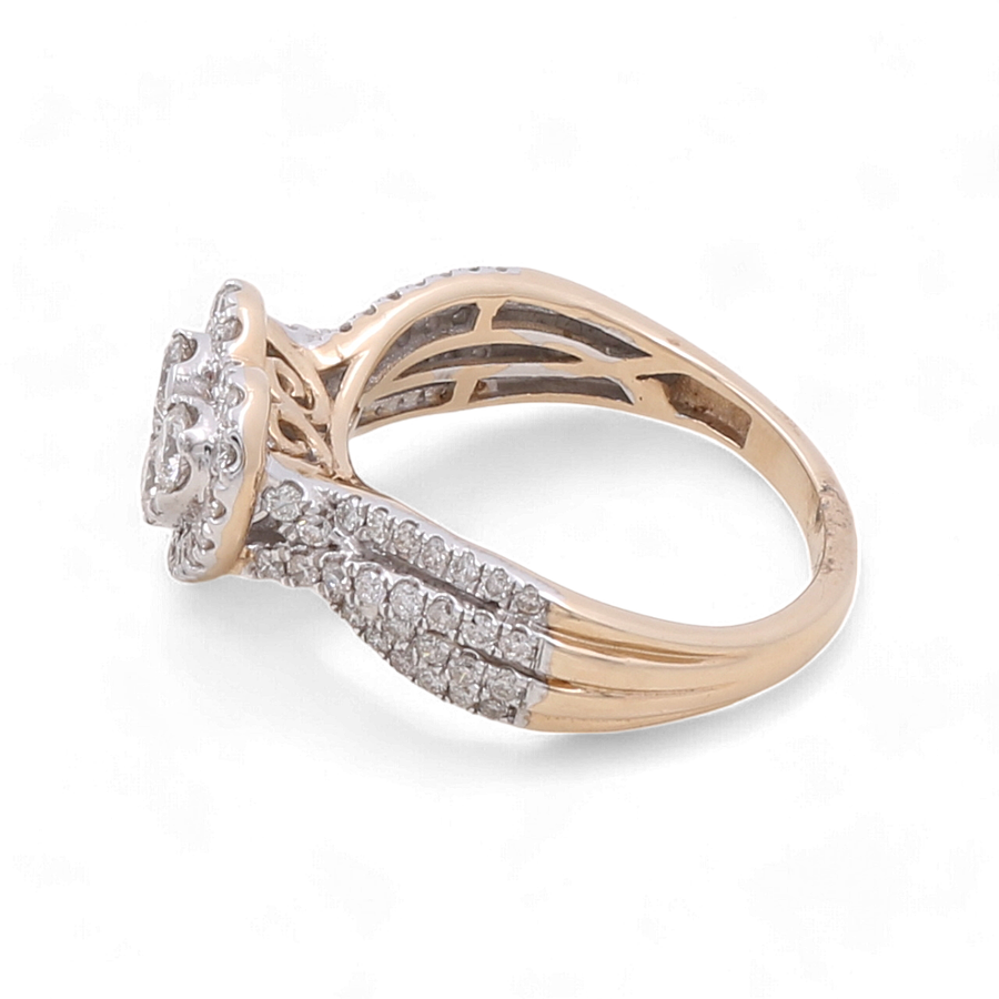 An elegant and glamorous 10K Yellow Gold Fashion diamond ring by Miral Jewelry, featuring an ornate split shank design and a central cluster of diamonds.