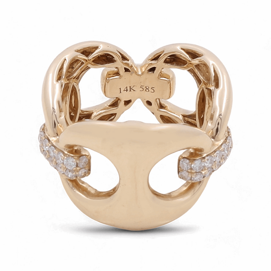 The 14K Yellow Gold Fashion Diamond Woman Ring by Miral Jewelry boasts an intricate open-heart design that exudes timeless elegance, featuring two curved bands adorned with small diamonds. The interior is marked with "14K 585".