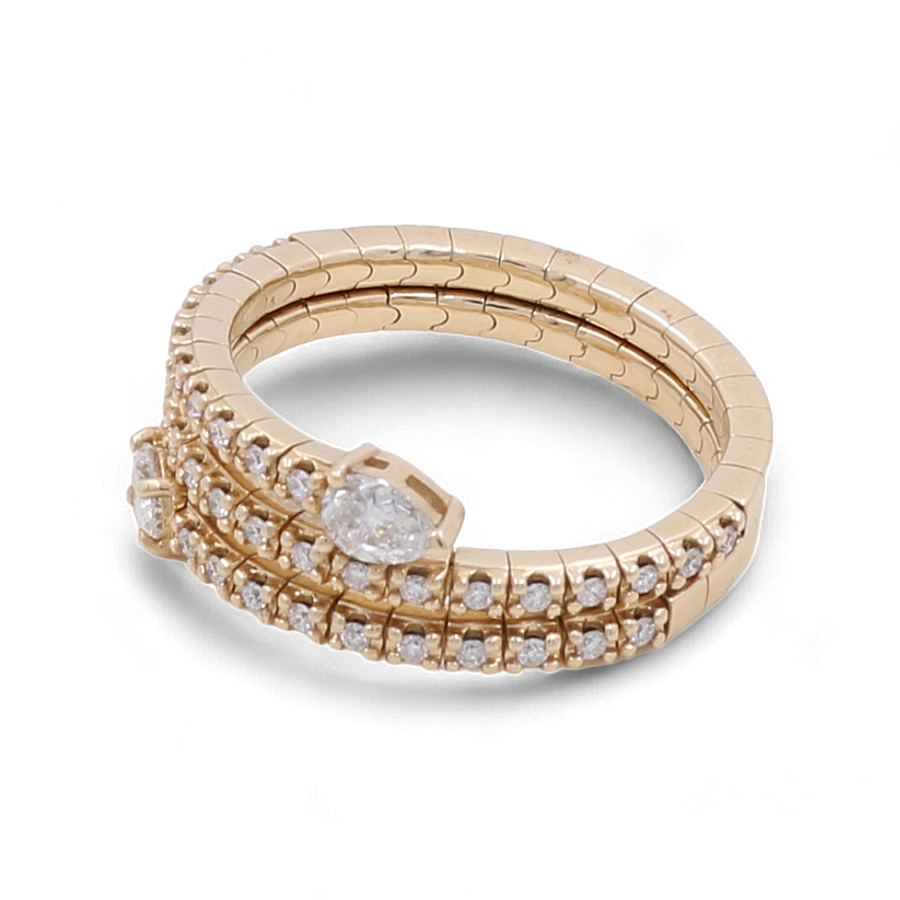 The 14K Yellow Gold Fashion Diamond Woman Ring by Miral Jewelry is a luxurious triple band design that showcases rows of small diamonds and a stunning central diamond, making it the perfect accessory for the fashion-forward woman.