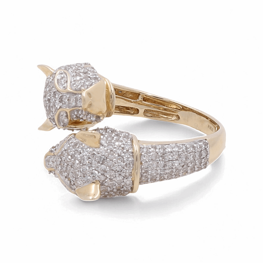 The Miral Jewelry 10K Yellow Gold Fashion Diamond Woman Ring is a luxurious piece, featuring two dog heads adorned with white gemstones in an open-ended design, complemented by a textured band that embodies elegance.