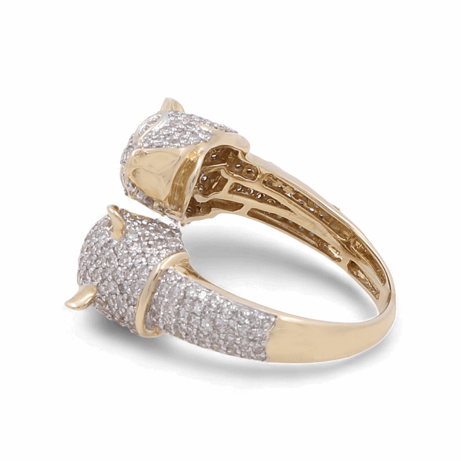 The 10K Yellow Gold Fashion Diamond Woman Ring by Miral Jewelry features a split shank design adorned with numerous small diamonds, creating a shimmering effect. This luxurious accessory is perfect for any occasion.