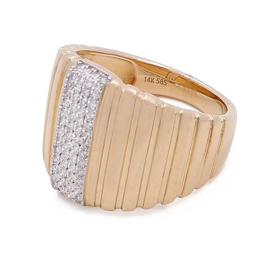 A 14K yellow gold ring with vertical grooves and a central section adorned with small round diamonds, the 14k Yellow Gold Fashion Ridge Ring with 0.23Tw Round Diamonds by Miral Jewelry, has the inside stamped with "14K 585".