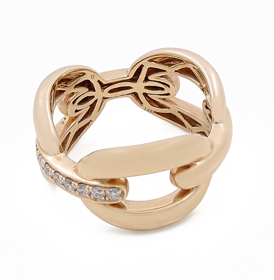 A Miral Jewelry 14k Yellow Gold Fashion Link Ring with 0.18Tw Round Diamonds featuring an intricate knot design and adorned with a band of small, round diamonds, this piece epitomizes luxurious jewelry.