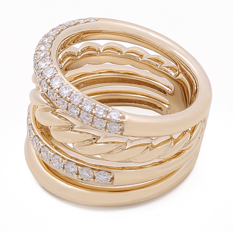 Miral Jewelry's 14k Yellow Gold Fashion Ring with 1.18Tw Round Diamonds features multiple intertwined bands, some adorned with small, round diamonds.